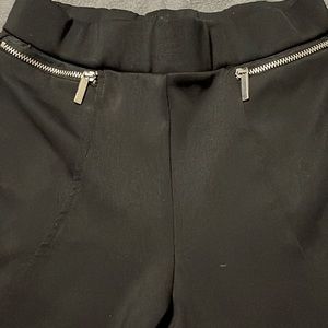 Black leggings, with gold zipper, and fish net sides